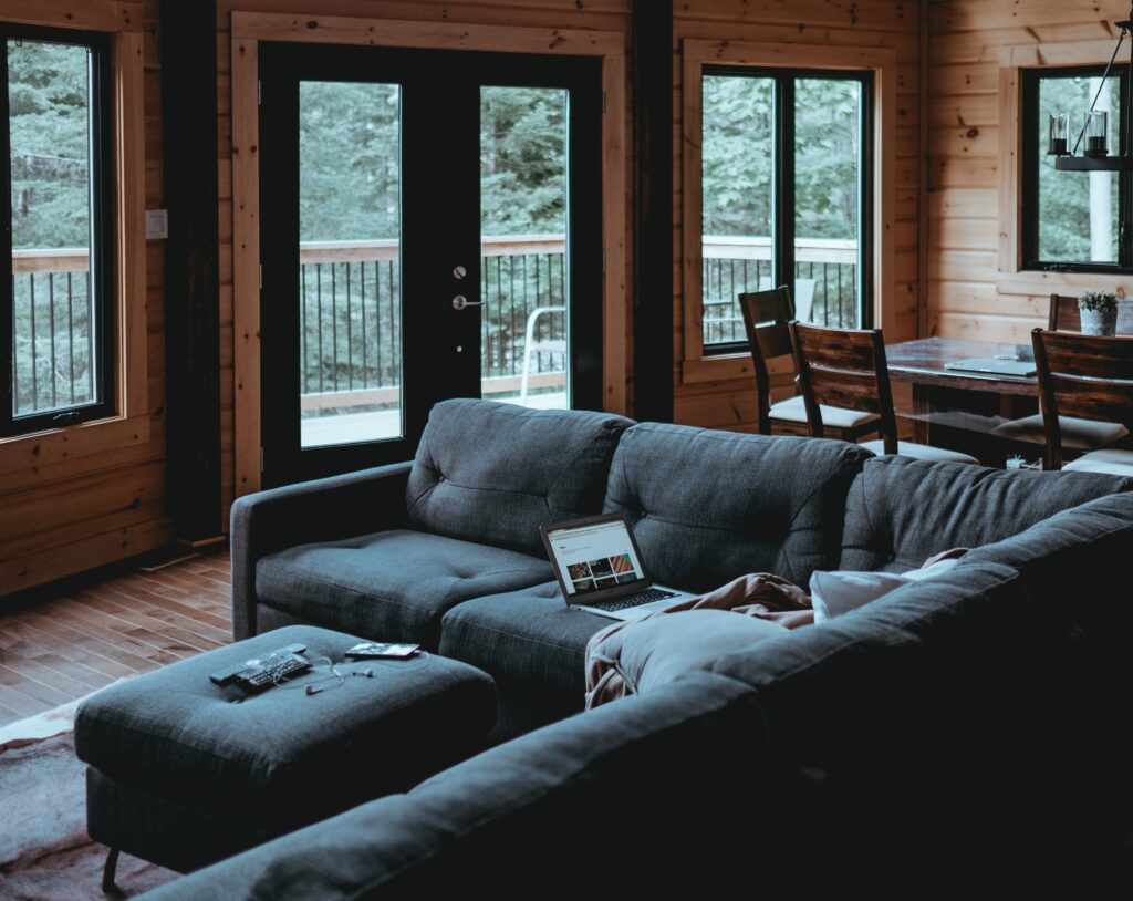A blue coloured navy blue L shaped sofa