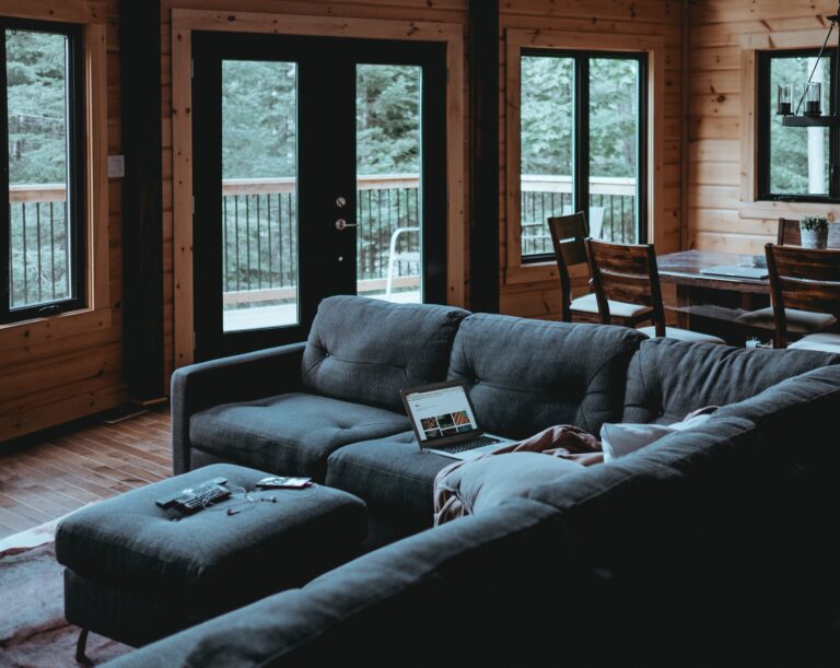 A blue coloured navy blue L shaped sofa